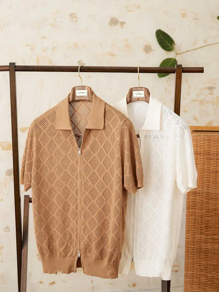 Light brown cotton short sleeve cardigan with a front zipper and lapel collar on a hanger.