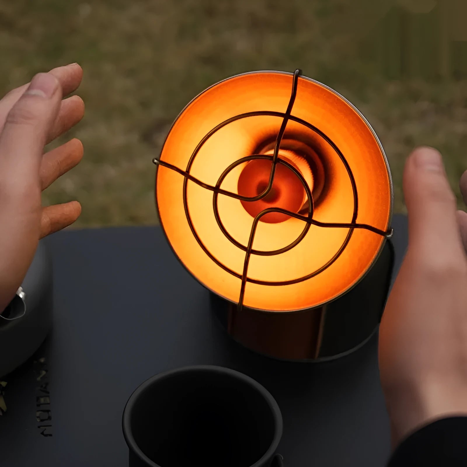 Black and orange portable gas heating stove for outdoor camping