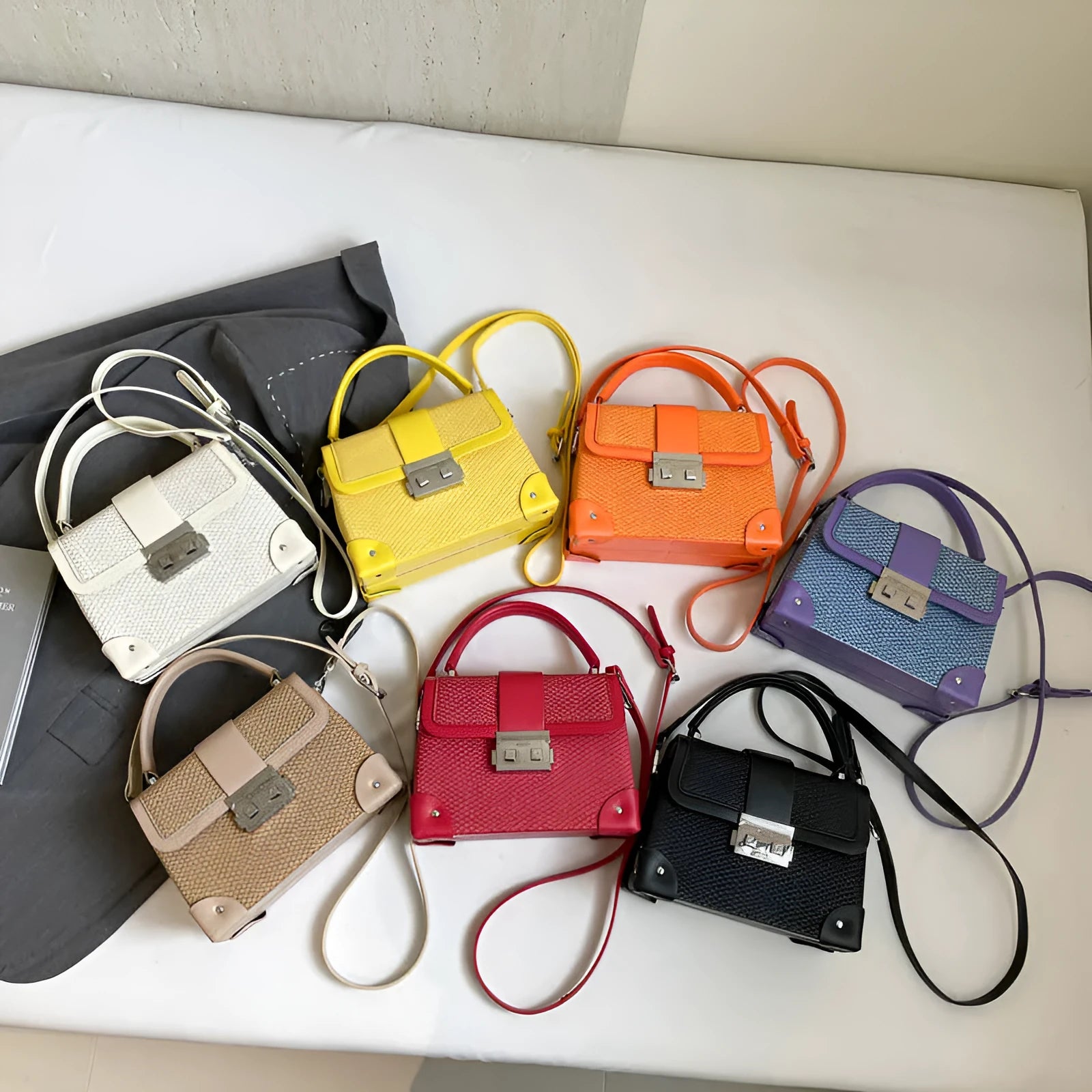 PU leather crossbody bag in horizontal square shape with sewing thread detail, available in seven colours
