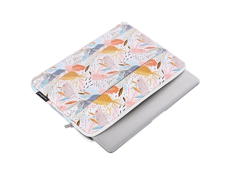White PU leather waterproof inner sleeve for a 14 inch laptop on a table.