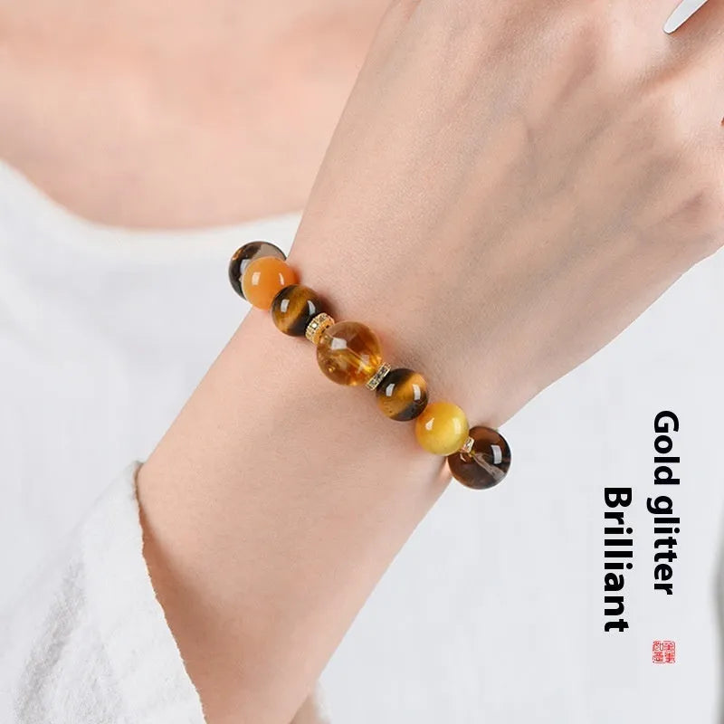 Natural yellow artificial crystal tower bead bracelet with 10mm beads on wrist