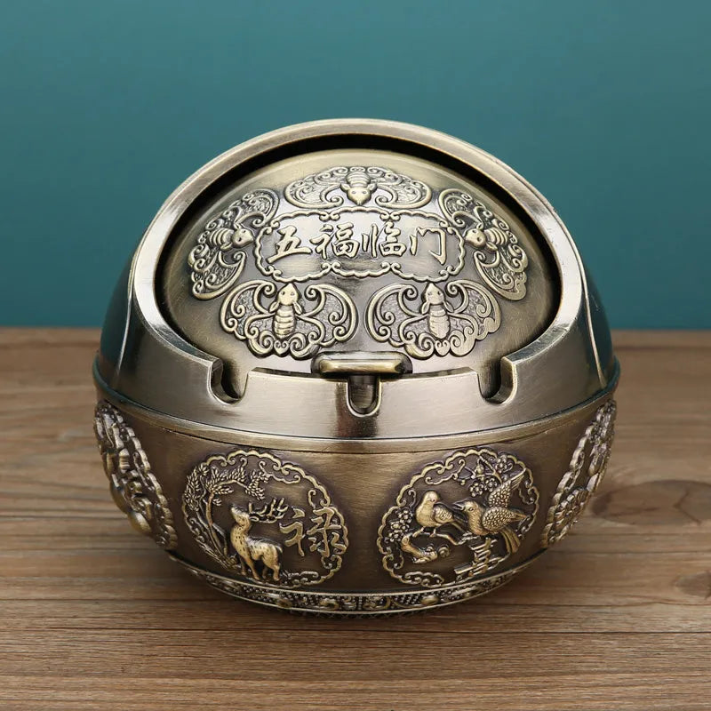 Bronze alloy ashtray with decorative fortune tree design and smoke extinguishing slot.