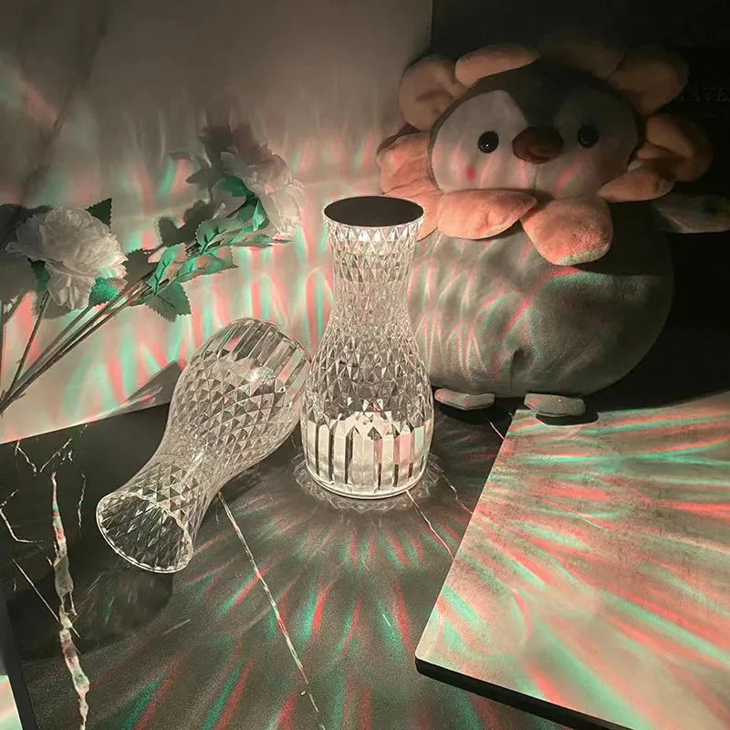 Vase-shaped crystal table lamp with diamond-like LED lighting on wooden surface