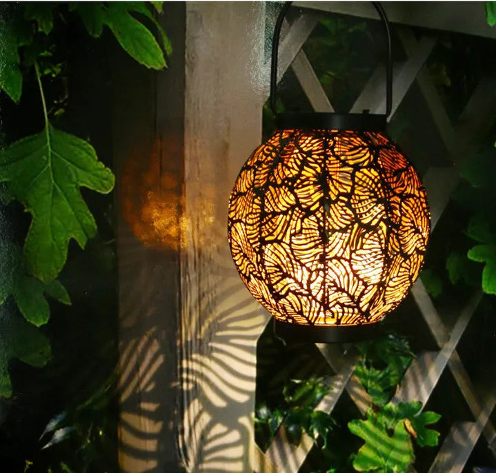 Solar-powered hollow decorative iron lamp for courtyard illumination