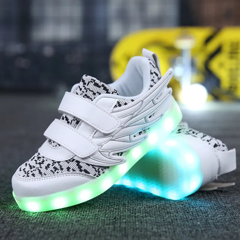 Children's plum red and white LED light-up trainers with USB charging port on the side.