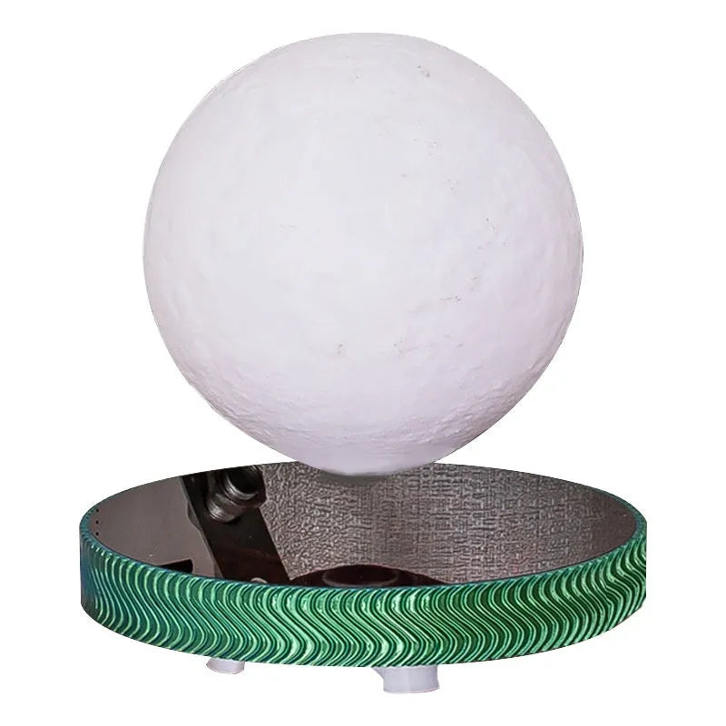 Small magnetic suspension night lamp in a choice of 3D-printed Moon, Saturn, or Bulb shapes on a dark background.