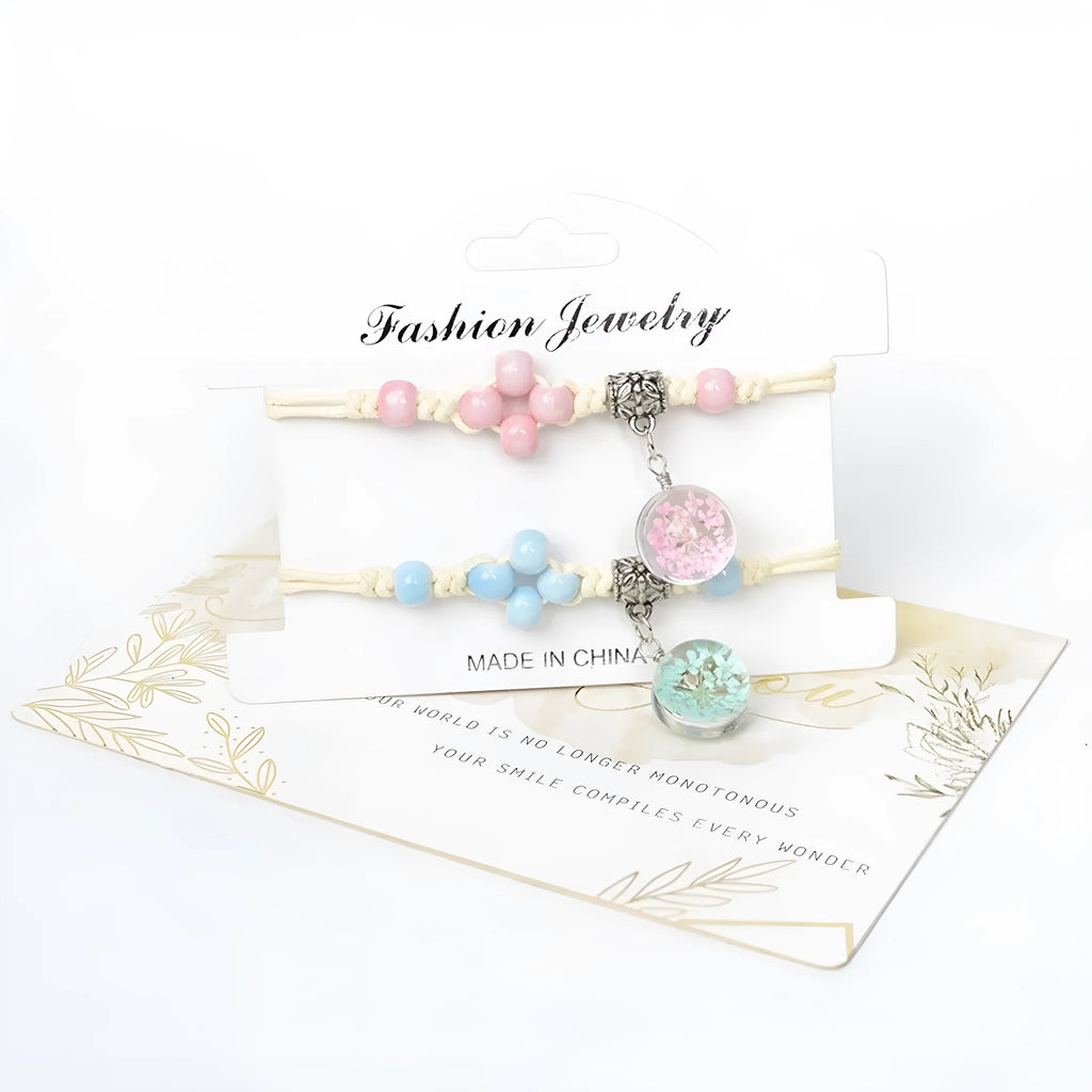 Hand-woven glass bracelet with large beads containing real dried flowers, shown in multiple colour options.