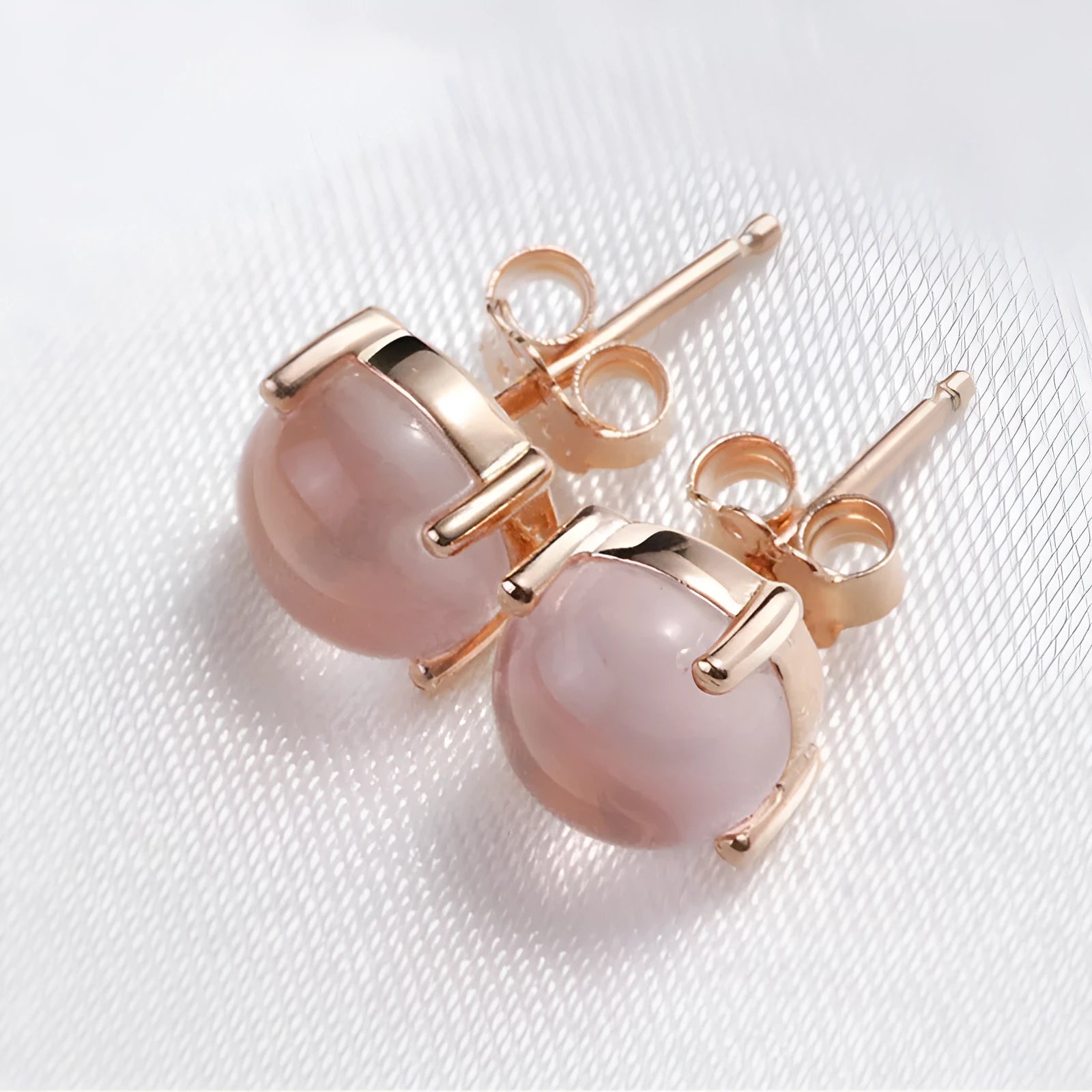 Korean style synthetic ross quartz stud earrings for women with rose gold plating and drop-shaped crystal inlay