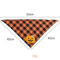 Orange Halloween dog bandana with pumpkin appliques and white skeleton design on plaid pattern