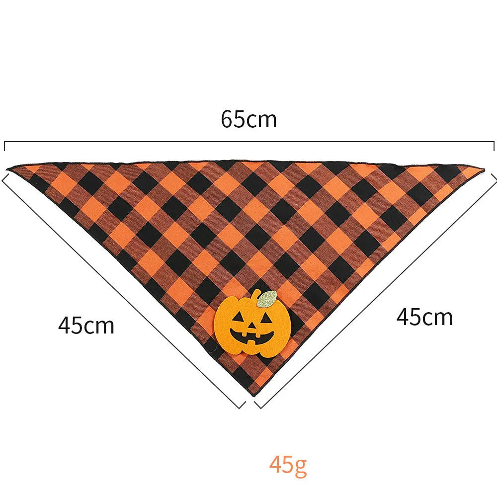 Orange Halloween dog bandana with pumpkin appliques and white skeleton design on plaid pattern