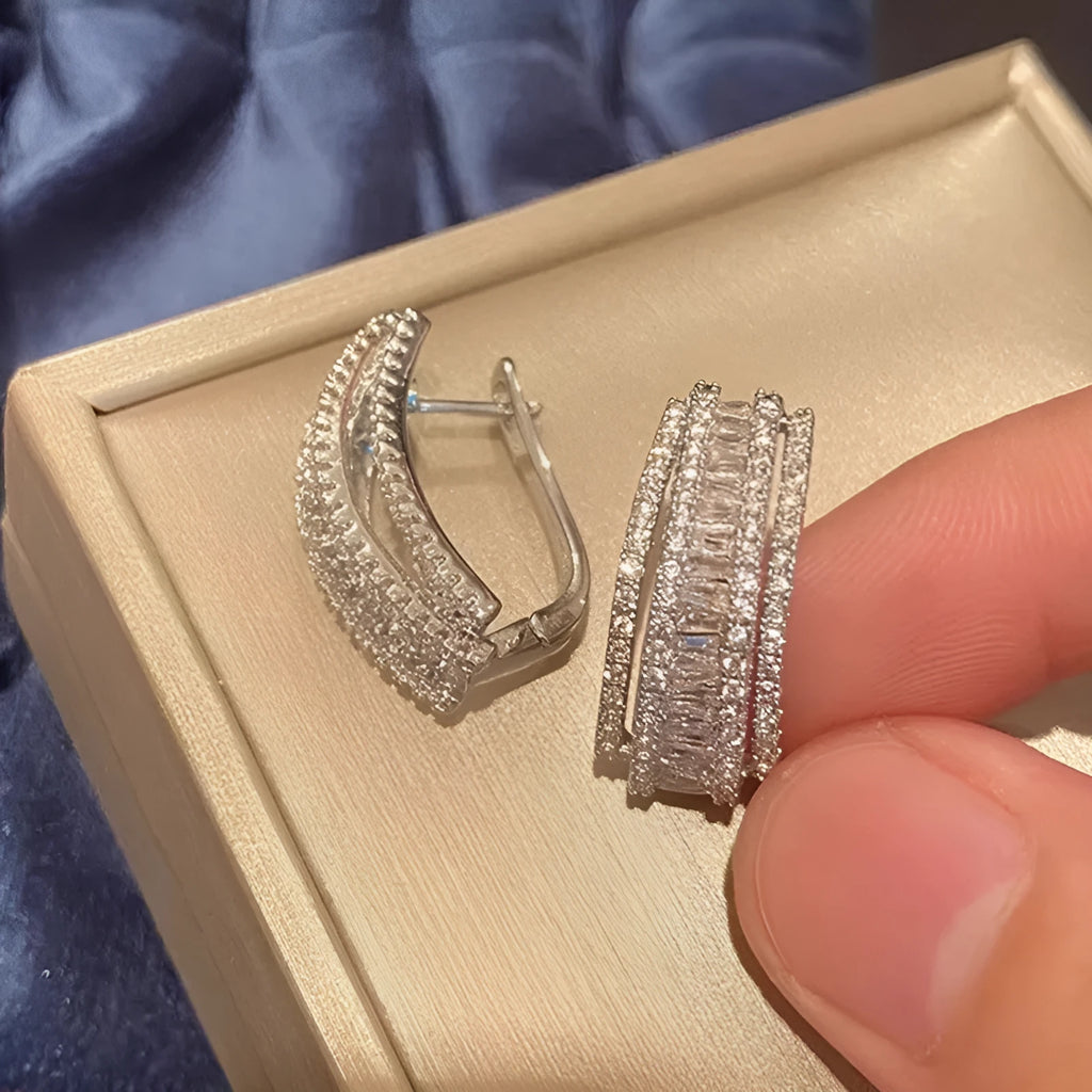 Women's geometry-shaped stud earrings with zircon detailing in white gold colour