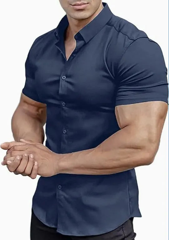 Man wearing a brown short sleeve printed casual shirt with a collar.