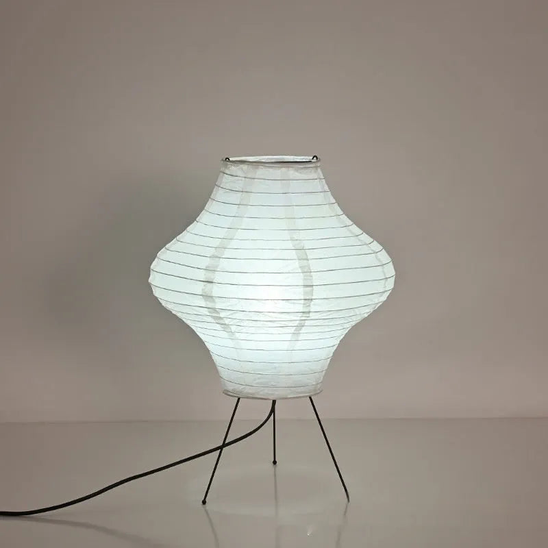 Silent Wind Japanese style Xuan paper table lamp with soft white glow on a wooden table.