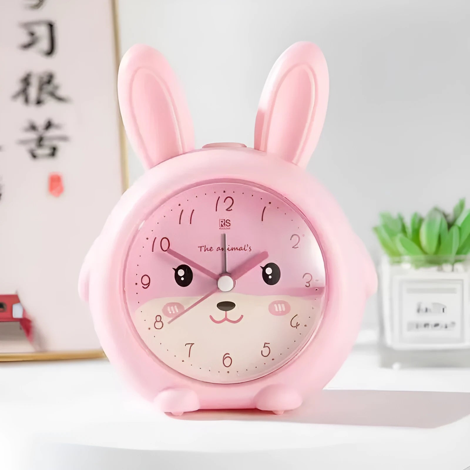 Children's cartoon alarm clock with singing alarm and night light in pink or blue ABS plastic