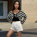A striped long-sleeved pullover sweater in mercerised cotton, shown in one of five available colours.