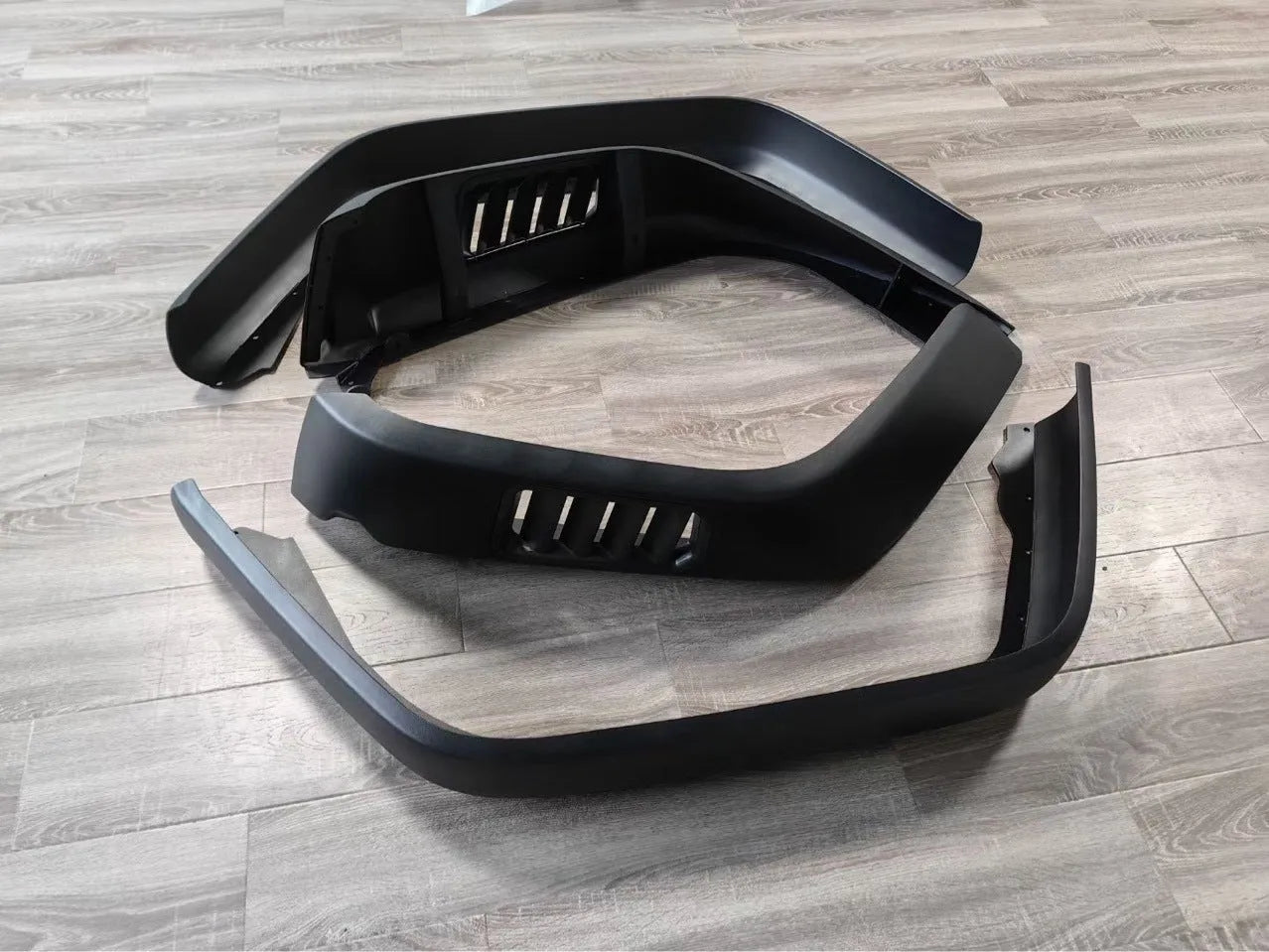 Black plastic car wheel arch set of four for universal fit on automobiles