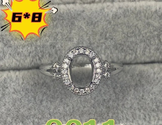 Oval denier fashion ring with open mouth setting, five-pointed star, and 6x8mm stone on copper band.