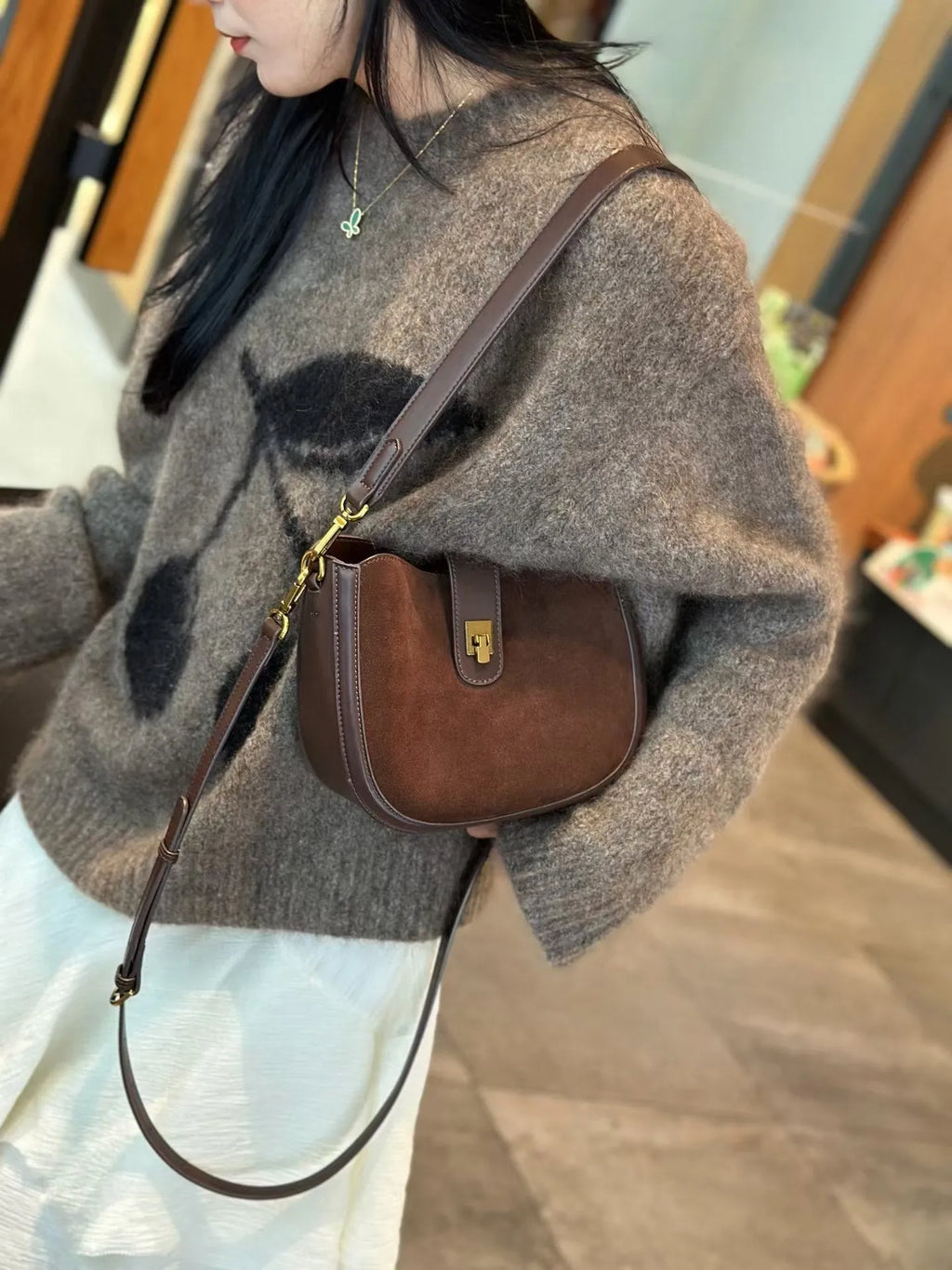 Women's brown genuine leather one-shoulder crossbody bag with a front sandwich pocket
