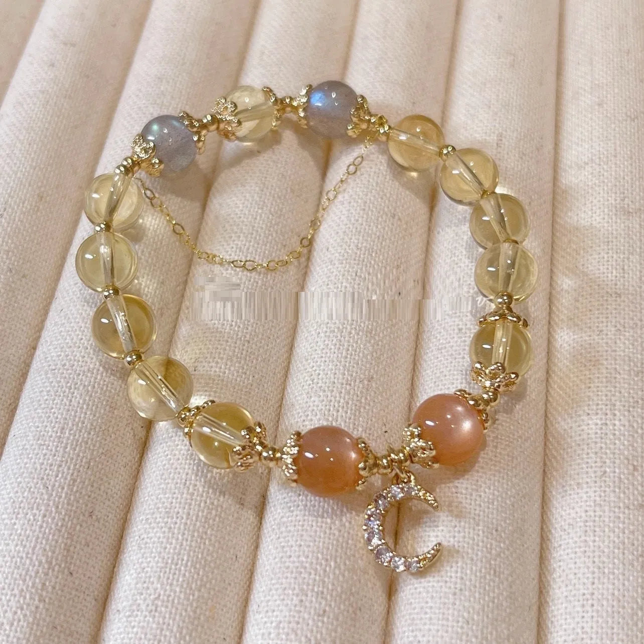 Chinese style women's crystal bracelet with diamond shaped stones and electroplated 14K gold gilded finish in citrine moon colour
