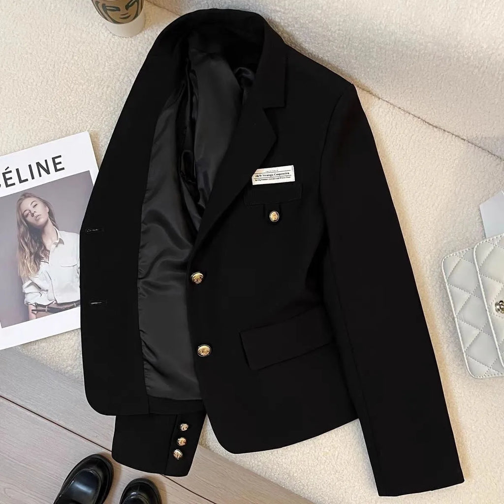 Black women's loose fit short suit coat with front pockets and regular long sleeves