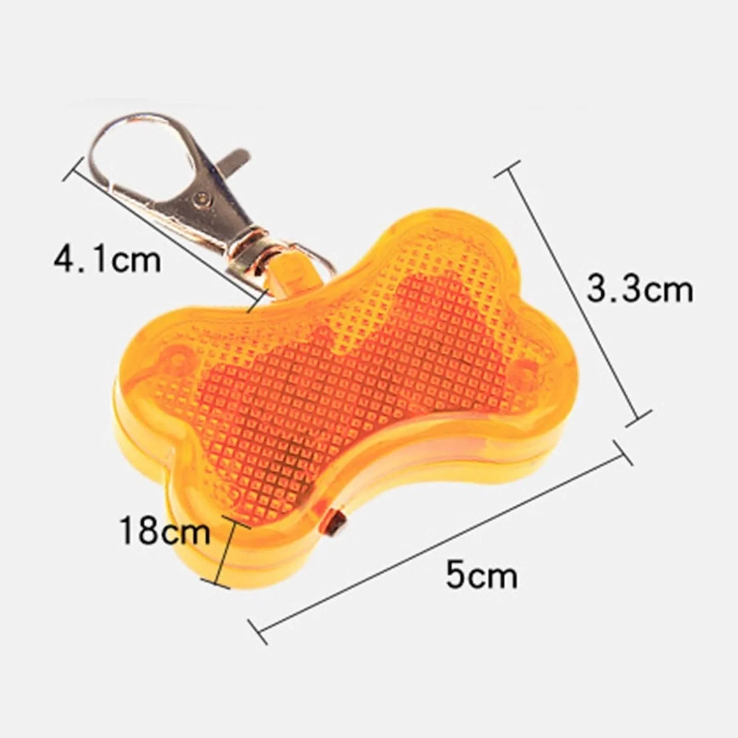 Blue LED luminous bone-shaped pendant for pet collars showing scale next to LR44 batteries.