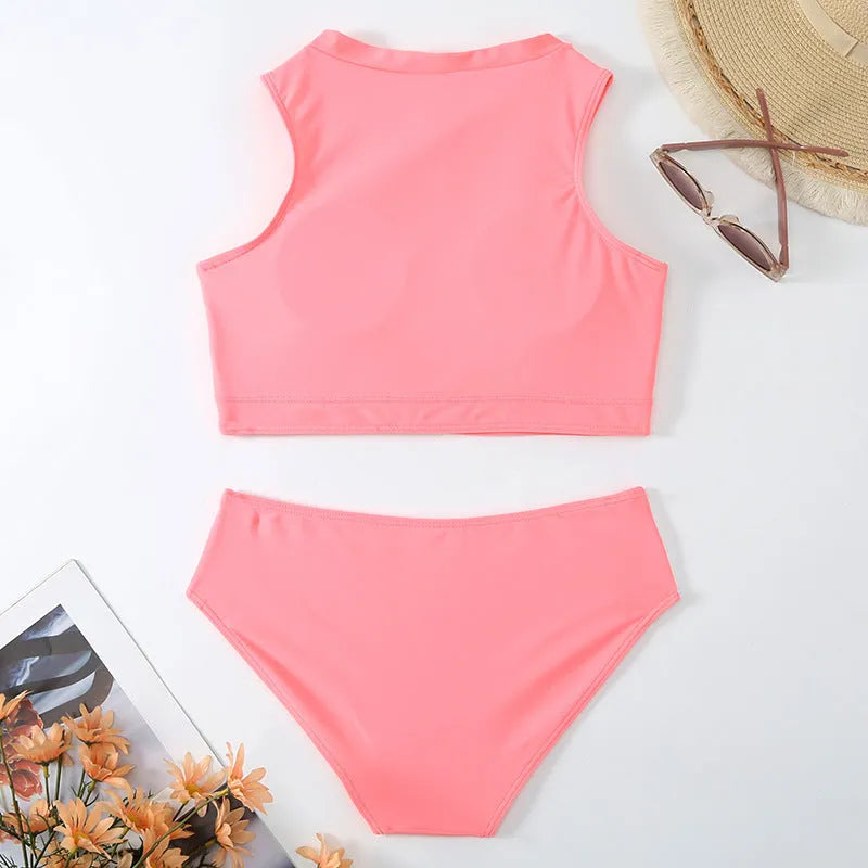 Pink high-waisted bikini set with sleeveless top and shorts on a mannequin