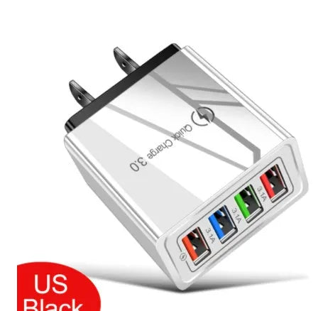 Simple Luminous 4-port USB wall charger in dark blue with LED light on, plugged into a socket.