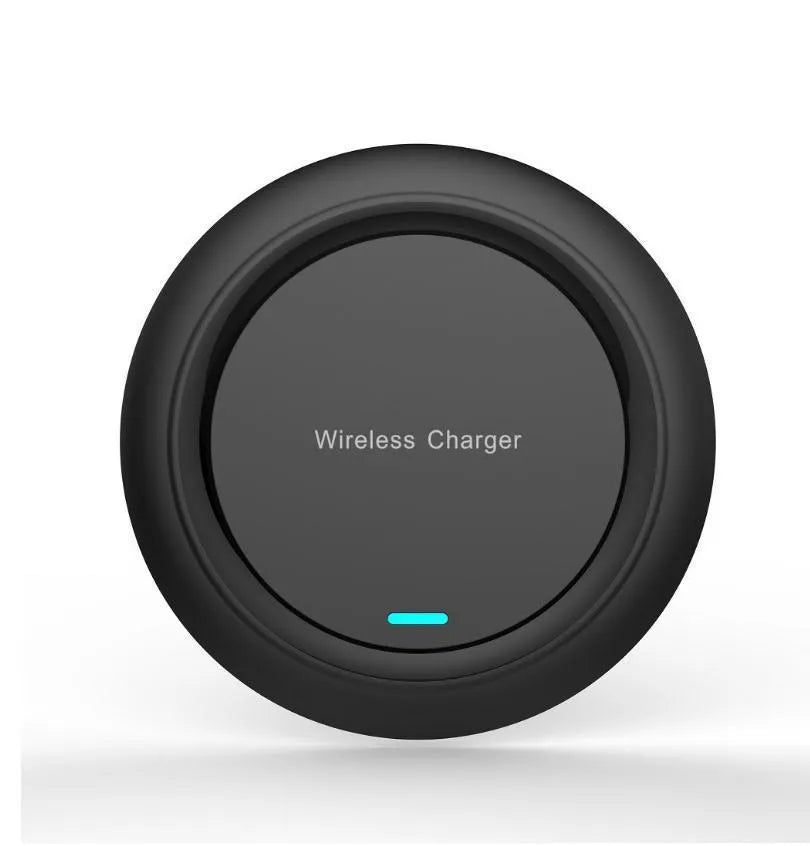 A round, slim 7mm thick 10W desktop wireless phone charger in black or white on a desk.