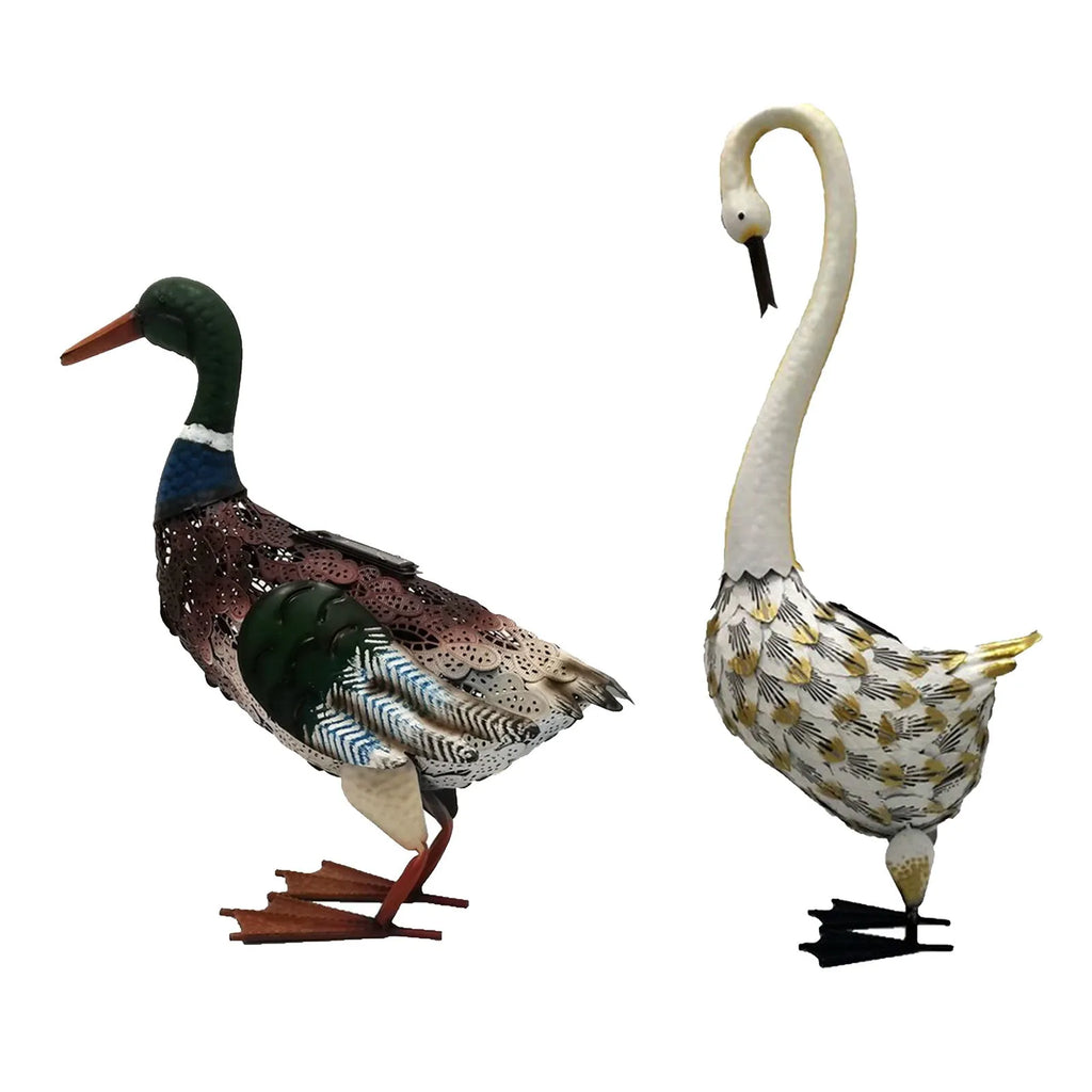 Solar powered duck-shaped wrought iron garden light with warm white LED on lawn