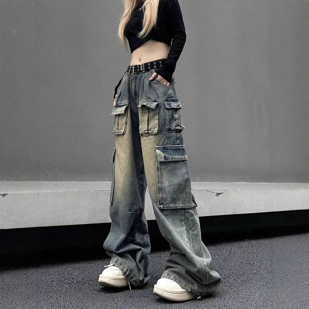Man wearing loose light blue distressed jeans with multiple pockets, showcasing the straight-leg and utility style.