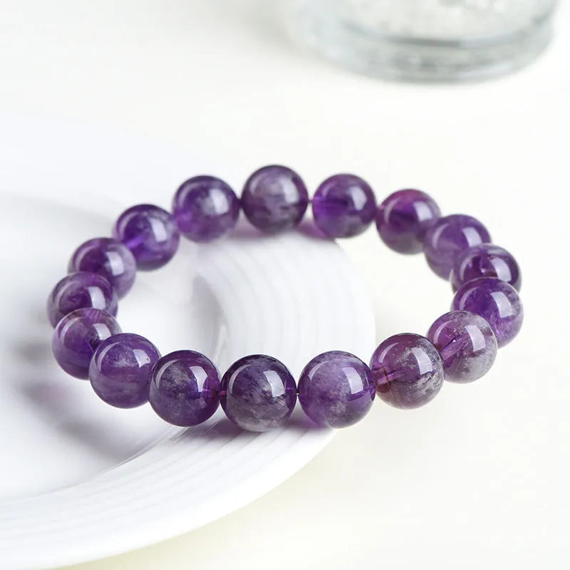 Natural feather amethyst crystal bracelet in snow mountain purple colour with scattered beads.