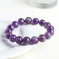 Natural feather amethyst crystal bracelet in snow mountain purple colour with scattered beads.