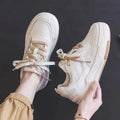 Women's low-top rubber sneaker in beige with height-increasing sole
