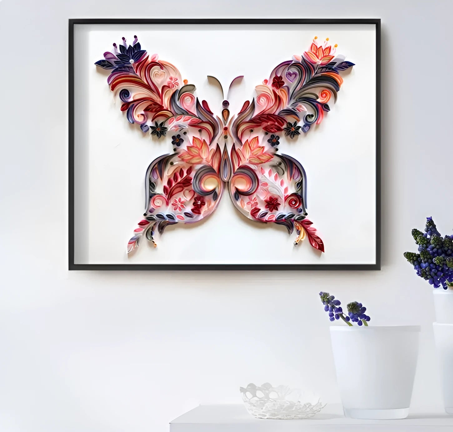 Handmade 20-inch Blue and Pink butterfly quilling paper craft kit with tools on a table