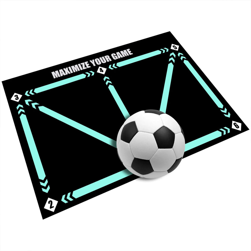 Black rubber football training mat measuring 60cm by 90cm on grass surface