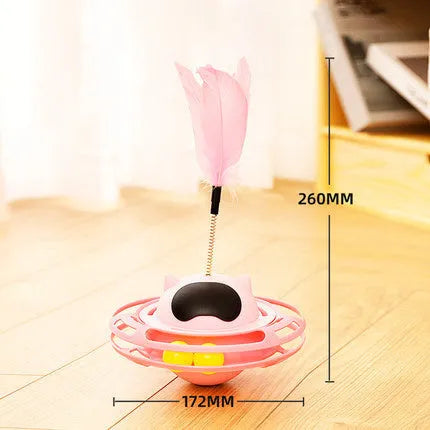 Pink cat tumbler turntable toy on a floor for feline self-play