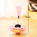 Pink cat tumbler turntable toy on a floor for feline self-play