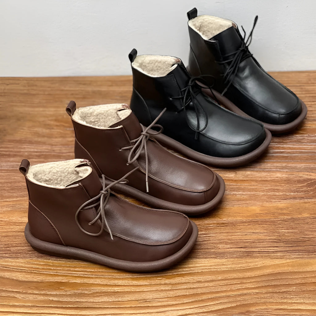 Women's black cowhide boots with flat heel and round toe, showing 9cm sock length