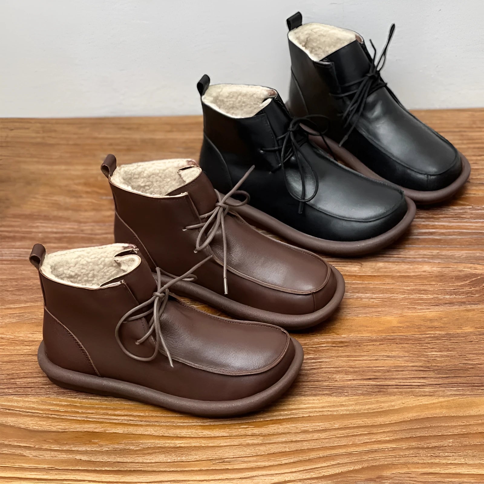 Women's black cowhide boots with flat heel and round toe, showing 9cm sock length