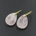 A pair of geometric water drop shaped earrings made from crystal in an electroplated finish.