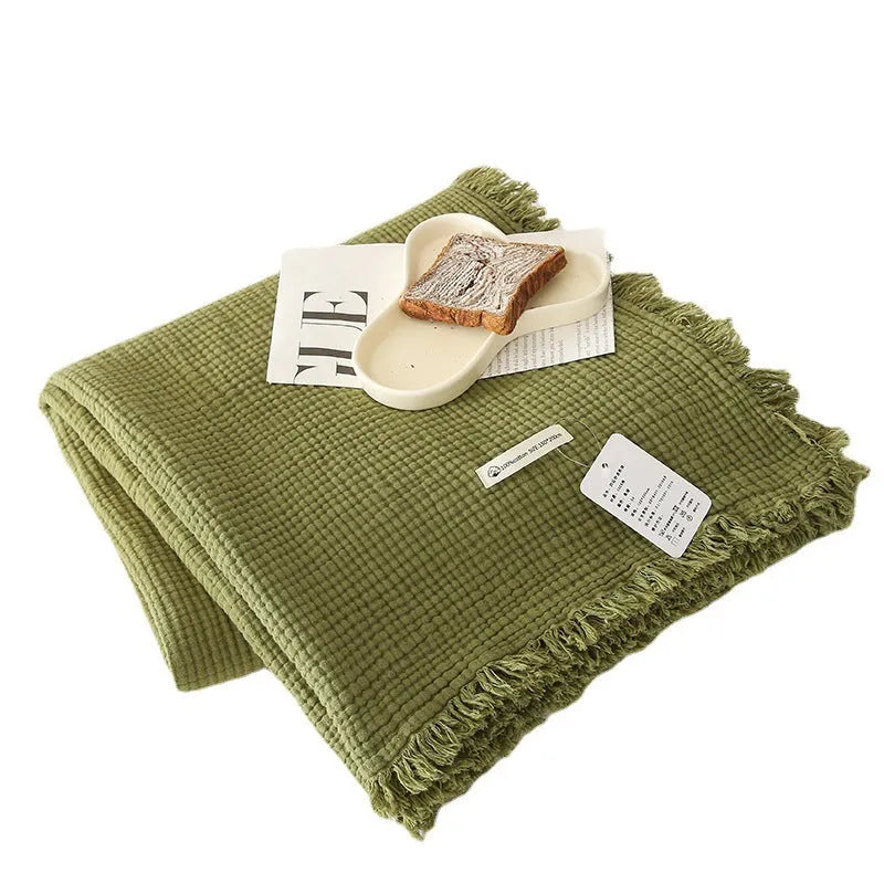 Four-layer cotton gauze blanket with tassel trim in navy blue colour