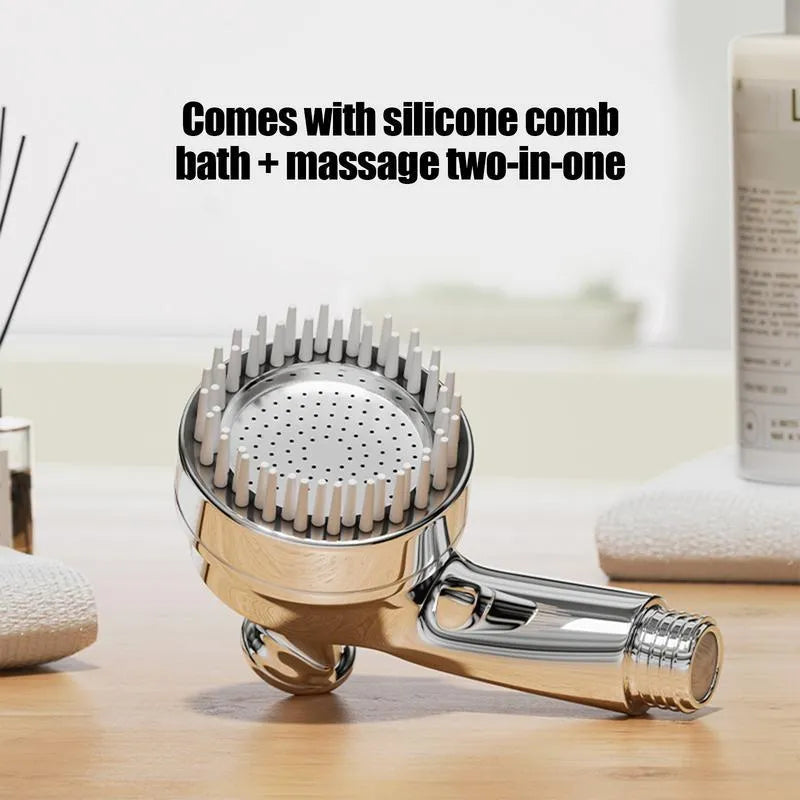 Silver coloured dog shower attachment with ergonomic grip and soft silicone comb teeth.