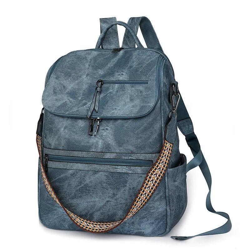 Retro solid colour PU backpack with curved shoulder straps shown in black.