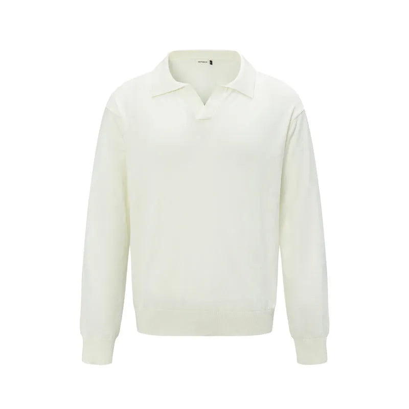 Man wearing a loose fit black acrylic pullover sweater for casual wear.