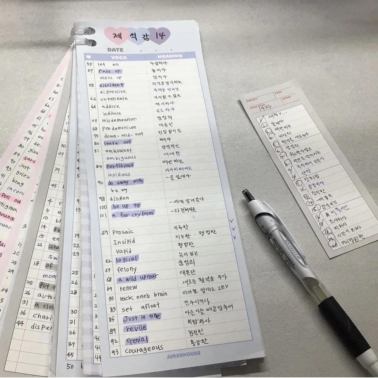 Vertical English word notepad in blue, pink, or purple cover, showing double-sided printed pages.