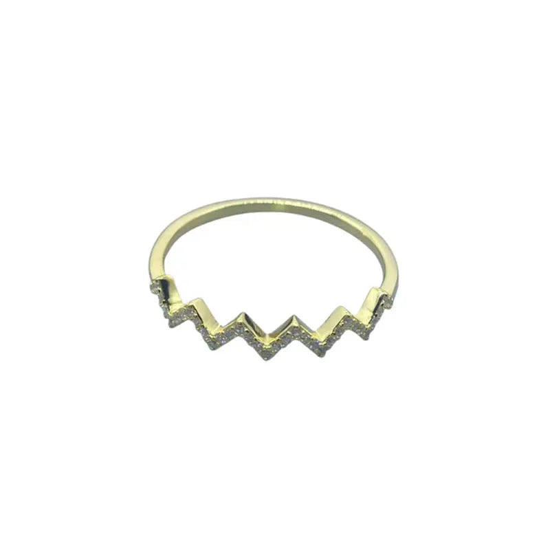 Sterling silver wave pattern adjustable ring with gem inlay, gold colour, against neutral background