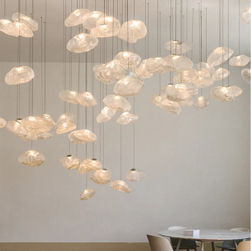 Postmodern style fabric chandelier with glass shade, shown in amber, clear, and smoke grey colours.