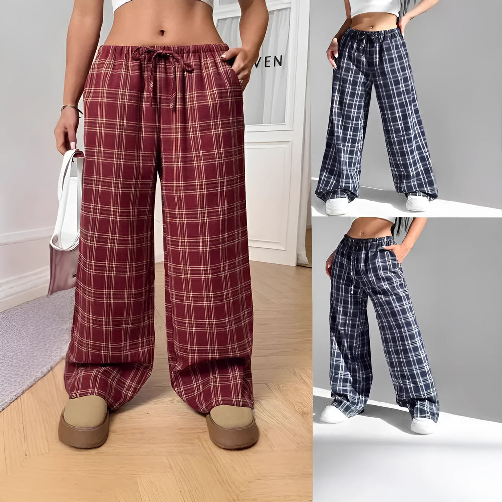 Red plaid women's casual trousers with a drawstring waist and pockets on a hanger.