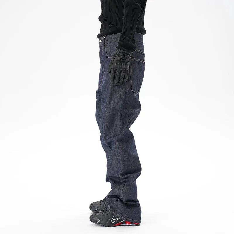 Man wearing dark blue loose fit straight leg denim jeans.