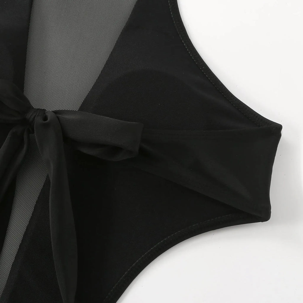 Black one-piece swimsuit with hollow-out strap design across back